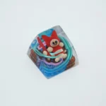Handcrafted Monster Hunter Palico SA R1 keycap shown from a dynamic new angle, highlighting its vibrant colors and charming sculpted artisan details.
