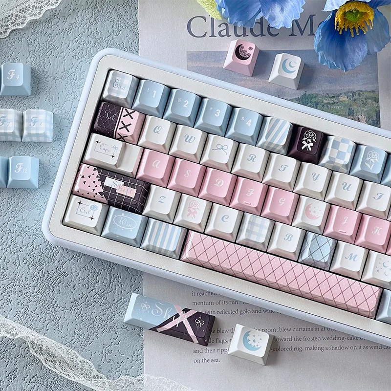 Experience the intricate details of the Elegant Moonlit Rose PBT Dye-sub Keycaps Set, revealing delicate rose motifs bathed in a soft, romantic moonlit design.