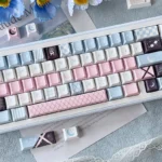An elegant Moonlit Rose PBT Dye-sub Keycaps set, viewed from an artistic angle, highlighting the delicate rose motifs and romantic dark aesthetic.