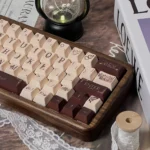 Exquisite Music Rose PBT Dye-Sub keycaps set showcasing delicate rose and musical motifs from multiple angles, highlighting their artistic elegance.