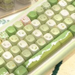 Artisan Nature PBT Keycaps: Serene Mountain Stream MCA Keycap Set. Dye-sub PBT keycaps, multi-angle views of serene mountain, stream, foliage, earthy tones.