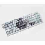 Angled view of the NieR Automata 2B side-lit PBT keycaps set, showcasing intricate dystopian elegance and iconic character details.