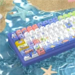 A collection of serene ocean themed PBT dye-sub keycaps set, showcasing tranquil blue and white wave patterns from various angles, creating an immersive setup.