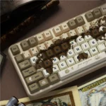 Detailed angle of premium Old World keycaps set, revealing intricate dye-sub explorer motifs and weathered map textures on durable PBT.