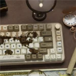 Old World keycaps set: Vintage Explorer PBT dye-sub set with intricate map motifs and weathered textures, for a nostalgic antique aesthetic.