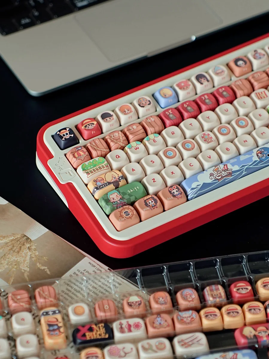 Explore various angles of the complete PBT One Piece Straw Hat keycap set, featuring vibrant, detailed anime characters and symbols for your next adventure.