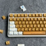 Detailed view of vibrant orange PBT keycaps set, highlighting their durable material and crisp dye-sub legends from a distinct angle, perfect for mechanical keyboard.