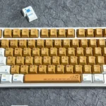 Vibrant orange PBT keycaps set, seen from various angles, highlight crisp dye-sub legends and durable PBT material, featuring a classic Cherry profile.