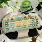 Adorable Panda Sanctuary MOA PBT Dye-Sub Keycap Set featuring whimsical pandas, bamboo, and lush green hues, bringing a playful sanctuary to your keyboard.