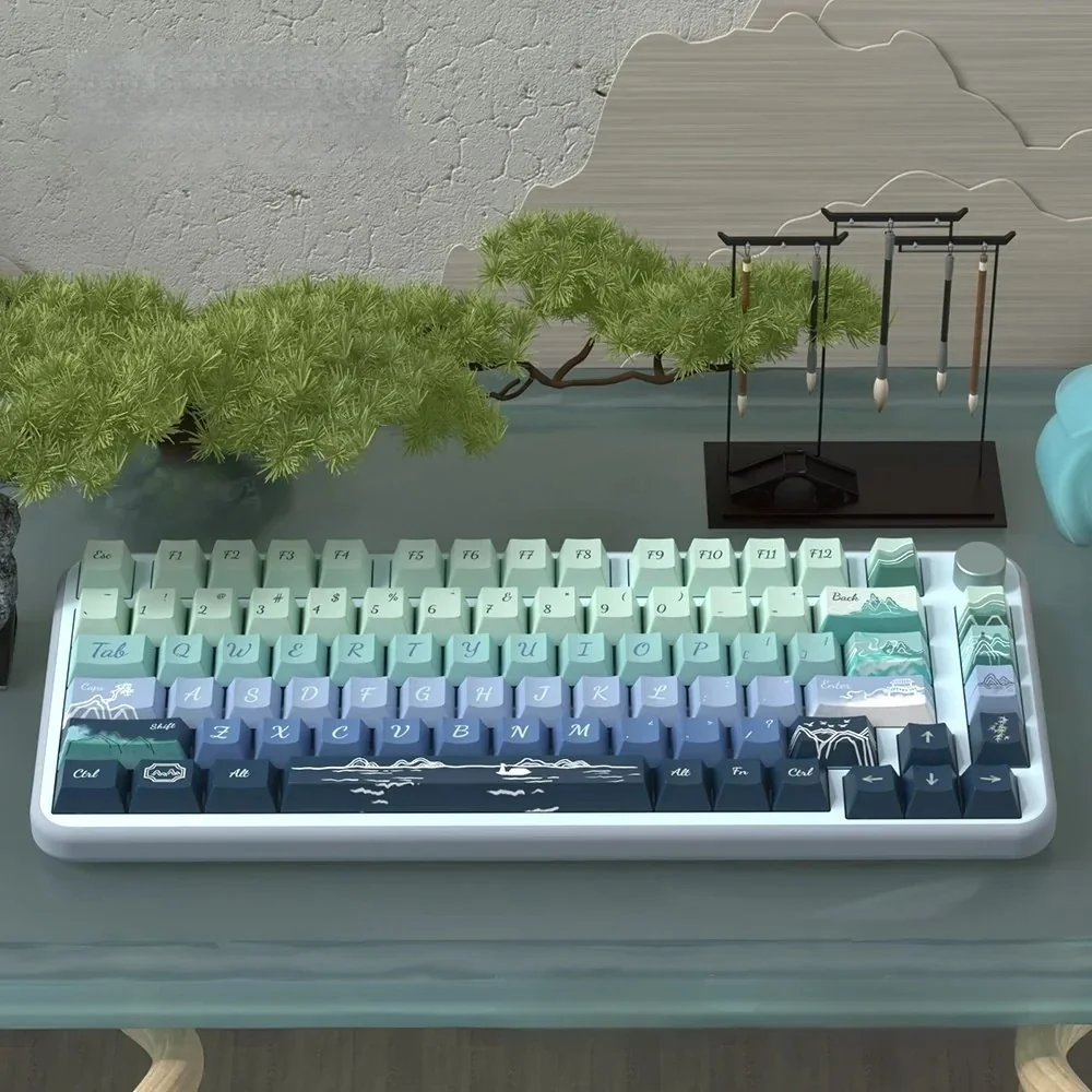 Artistic Serene Wind Dye-Sub PBT Keycap Set. Features tranquil natural landscapes, gentle wind, and cloud motifs. Soothing colors for serene typing.