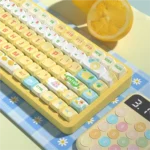 Detail shot of unique Sea Salt Lemon Cheese PBT Keycaps Set, MDA profile, highlighting their soft pastel blue, vibrant yellow, and creamy white blend.