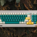 Vibrant Rainforest PBT Dye-Sub Full Keycap Set, featuring lush greens, earthy browns, and tranquil yellow for an artistic, immersive escape.