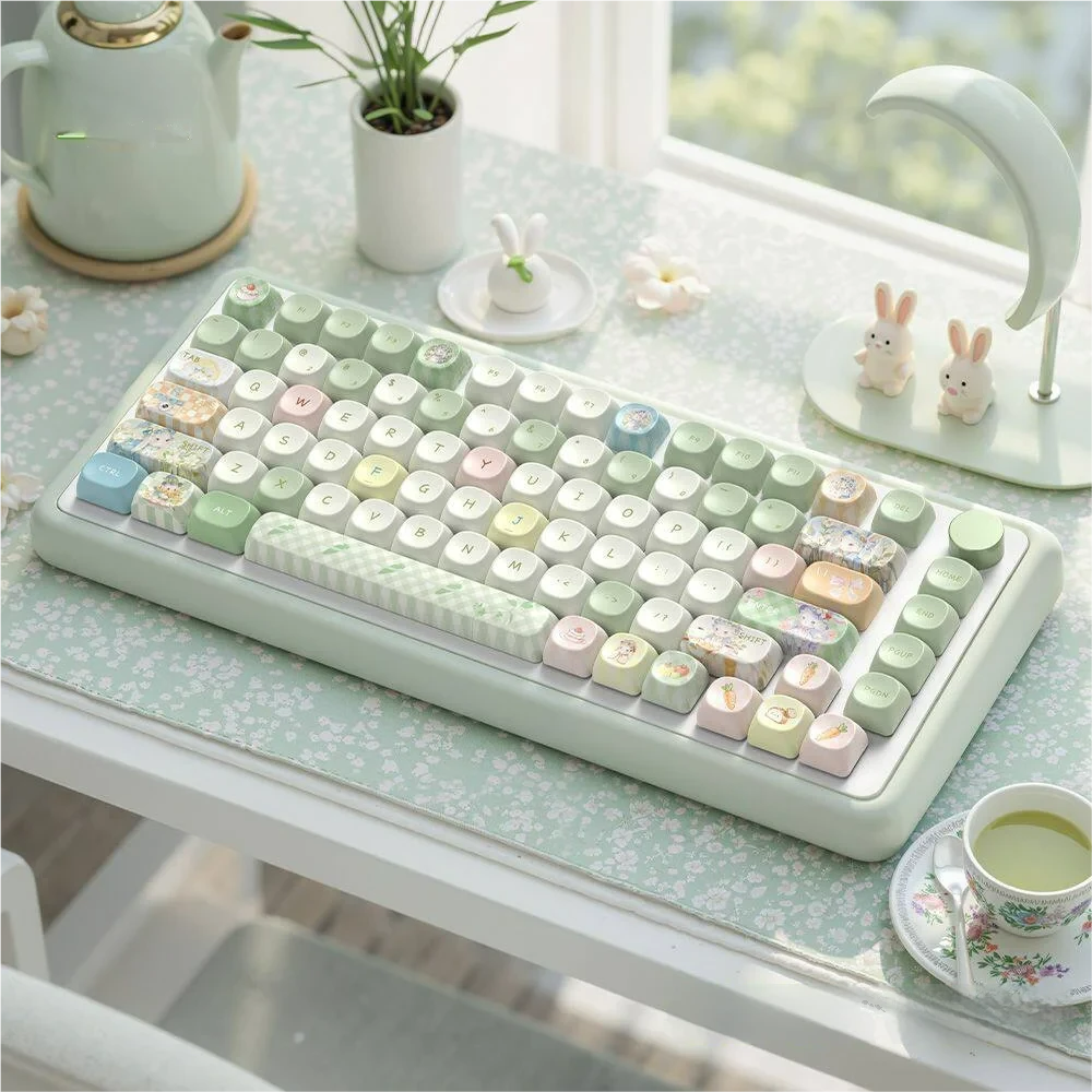 Adorable Picnic Bunny MOA profile PBT dye-sub keycaps set from a top-down view, highlighting charming pastel hues and whimsical nature-inspired picnic design.
