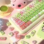 A vibrant collection of whimsical Crazy Thursday Piggy PBT keycaps set, showcasing various playful pig characters from multiple angles.