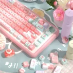 Ethereal Pink Glacier PBT Dye-Sub keycaps set, SCA profile, in multiple views. Soft pinks, icy blues, and foggy whites form a dreamy glacier landscape.