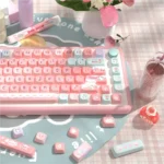 Ethereal Pink Glacier SCA PBT keycaps set from various angles. Soft pinks, icy blues, foggy whites, forming a dreamlike glacier scene.