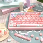 Ethereal Pink Glacier PBT Dye-Sub keycaps set from various angles. Soft pinks, icy blues, and foggy whites elegantly blend, creating a captivating, dreamlike design.
