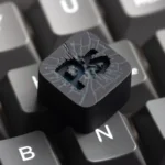 Artisan PS keycap for retro gaming ESC, showcasing its vibrant, translucent resin and iconic PlayStation symbols, designed for stunning backlight effect.