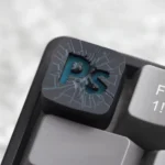 Artisan PS ESC Keycap: Iconic PlayStation symbols in vibrant, translucent resin, shown from various angles. Perfect for retro gaming and backlight comfort.