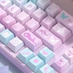 Ethereal purple butterfly PBT dye-sub keycap set. Artistic purple butterflies dance across keys, shown from various angles, creating a dreamy fantasy.