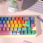 Quirky Keycap Set: quirky fantasy designs, vibrant dye-sub legends, durable PBT. Artistic, whimsical aesthetic from multiple angles.