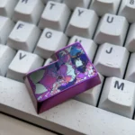 Multiple detailed views of the premium Raiden Shogun Titanium Enter keycap, showcasing its electro-infused elegance and polished finish from various angles.