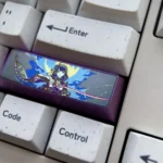 Majestic titanium Raiden Shogun keycap for Genshin Impact, displayed from various angles, highlighting its premium anodized finish and intricate Electro design.