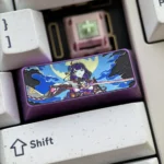 Detailed angle of the premium titanium Raiden Shogun keycap, highlighting its ethereal metallic luster and intricate Genshin Impact character art.
