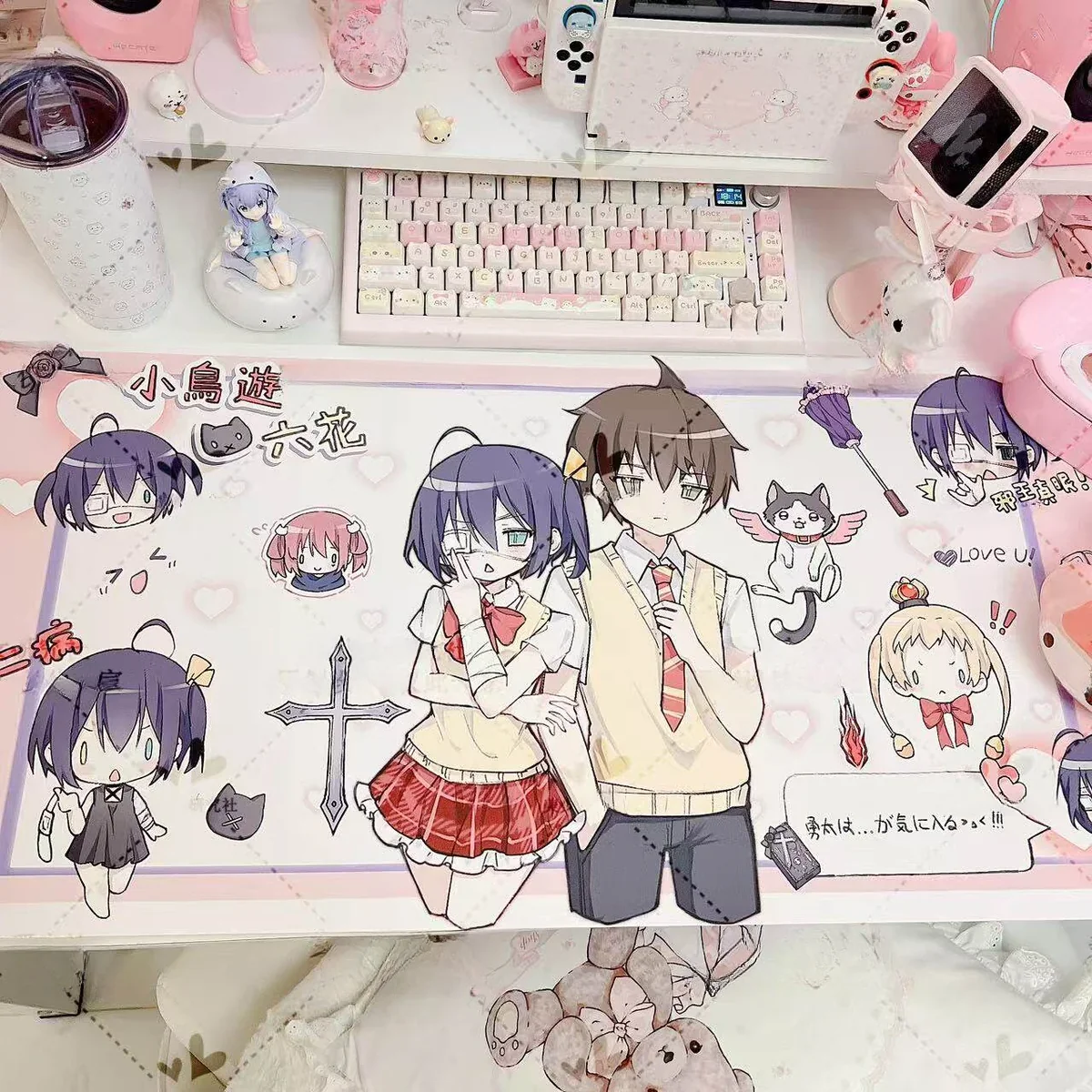 Exclusive Rikka Takanashi Desk Mat showcasing vibrant anime art, her dynamic pose, and Chunibyo magic. A unique accessory for fans.