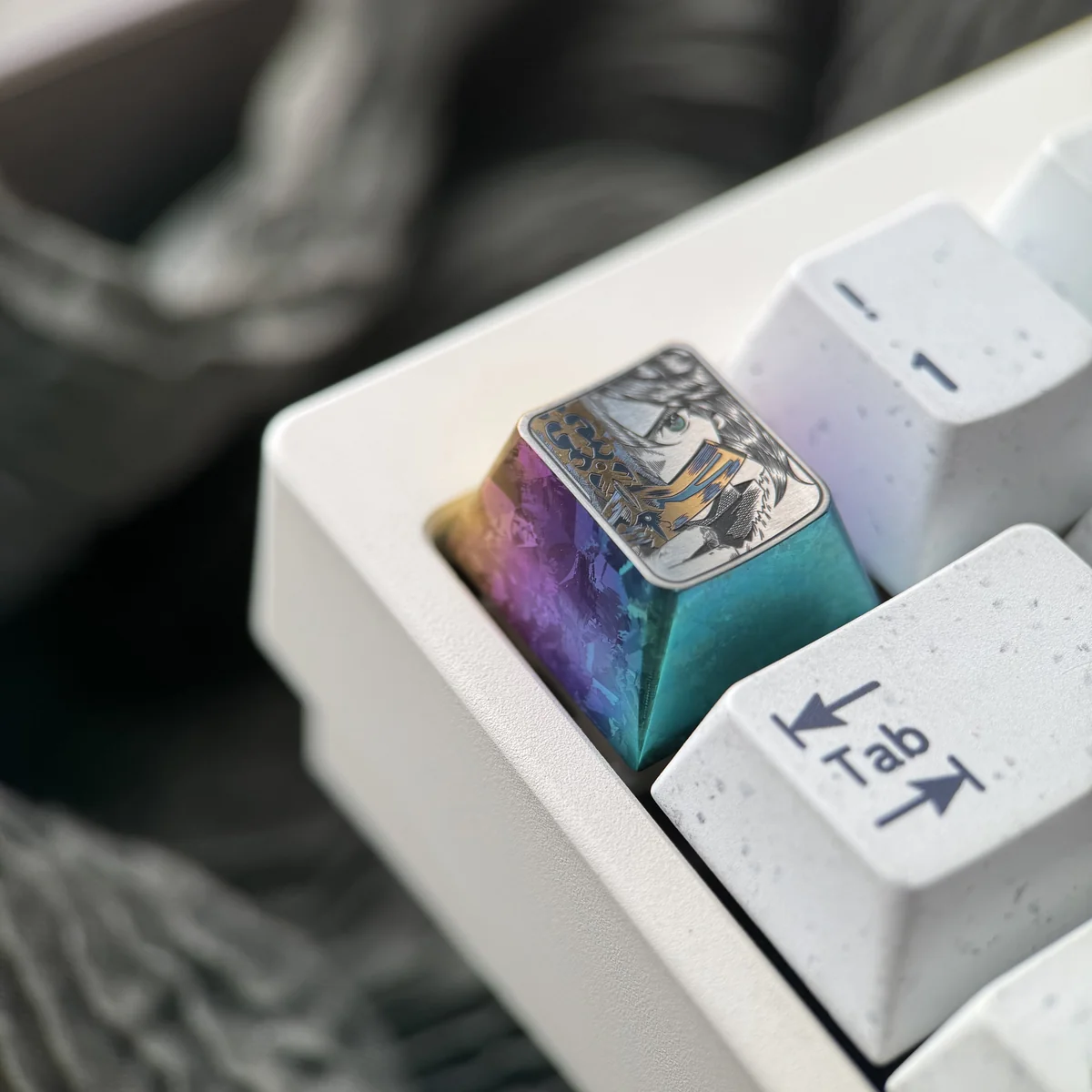 Close-up of the Saber Titanium Keycap, highlighting its dazzling iridescent ice crystal hues and precise iconic anime art. Premium titanium for colletors.