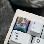 Iconic Saber Titanium Keycap displayed from various angles, revealing its premium titanium build, dazzling iridescent ice crystal hues, and precise angles.