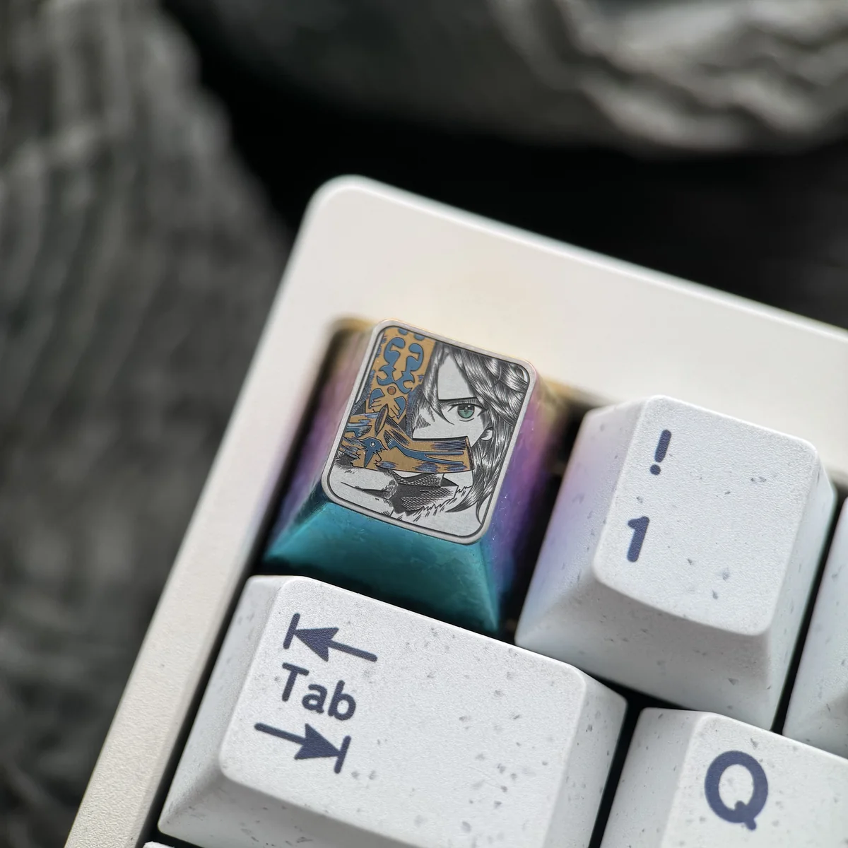 Iconic Saber Titanium Keycap displayed from various angles, revealing its premium titanium build, dazzling iridescent ice crystal hues, and precise angles.