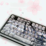 Premium Sakura Side-Lit PBT Keycaps set, showcasing delicate cherry blossoms and luminous legends from various appealing angles.