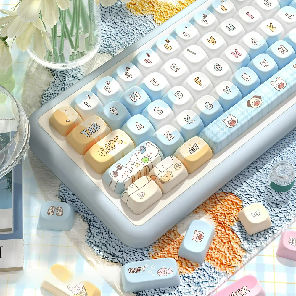 Seaside PBT Keycaps Set: serene ocean blue and warm sandy tones. Artistic dye-sub designs depicting tranquil beaches, emphasizing immersive PBT texture.
