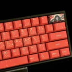 Close-up views of the exclusive Snake Woman PBT keycap set, showcasing intricate dark fantasy art and enigmatic character details from various angles.