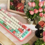 Artistic Spirited Away PBT keycaps set, showing whimsical Ghibli characters and enchanting bathhouse scenes from various angles. An immersive magical design.