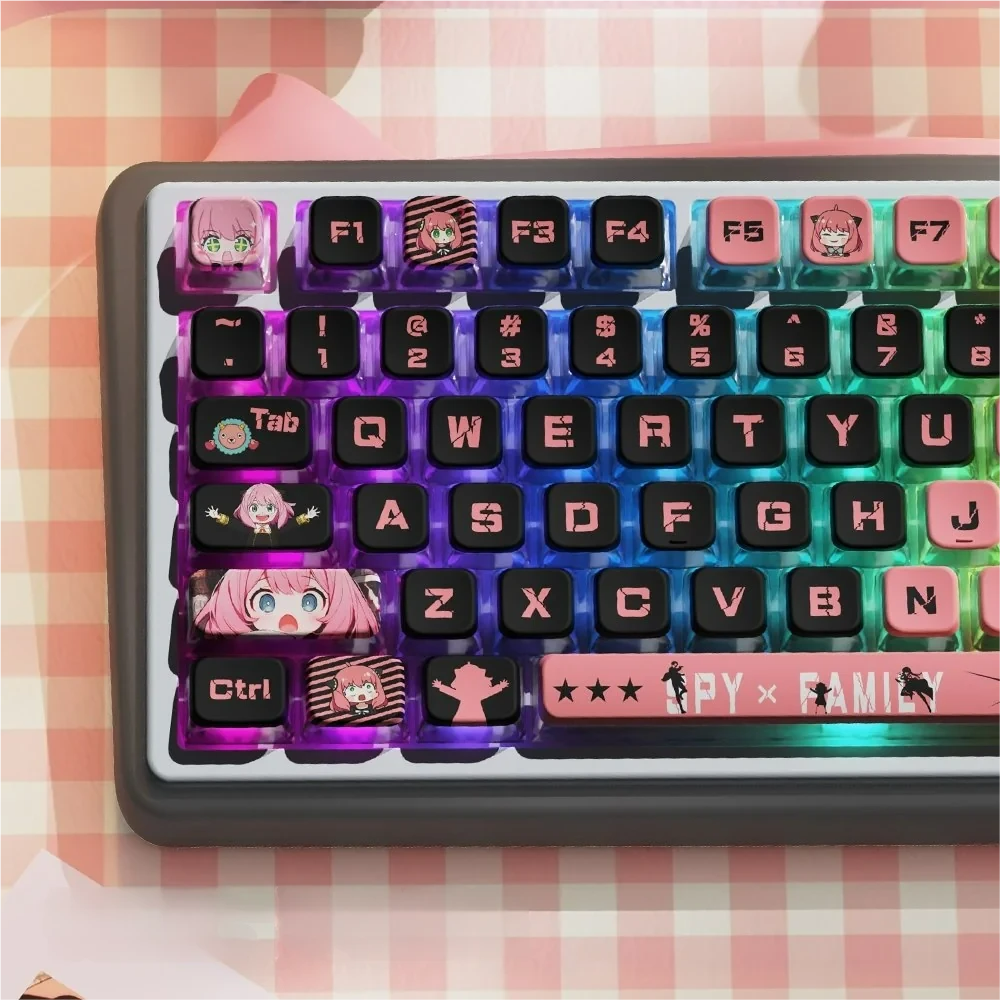 Playful Spy x Family RGB PBT keycaps set from a dynamic angle, showcasing vibrant characters and crystal-clear four-sided translucence with a lively RGB.