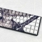 A collection of Straw Hat Keycap Set images, showing the iconic side-engraved character design and backlit PBT from various playful angles.