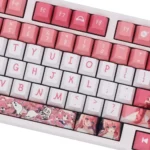 Close-up of Bocchi the Rock Hitori Gotoh PBT dye-sub keycaps set, showcasing vibrant, playful anime art from multiple angles and their durable quality.