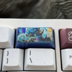 Premium, vibrant Super Saiyan Blue Vegeta titanium keycap, 2U backspace. Intricate metallic detail and iconic power across multiple views.