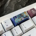 Close-up of the iconic Super Saiyan Blue Vegeta titanium keycap, showcasing its vibrant blue hues and intricate metallic detailing from a powerful design.