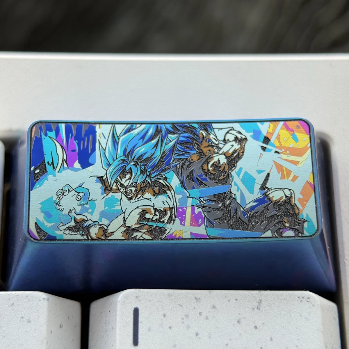Vibrant Super Saiyan Blue Vegeta titanium keycap, showcasing intricate metallic detail and a premium finish, highlighting this iconic 2U backspace key.