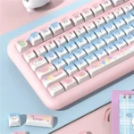 Cinnamoroll PBT keycaps set arranged from a side angle, revealing the soft blue-pink pastel gradient and sweet, dreamy design.