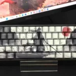 Detailed angle of Mythical Sword Immortal PBT Dye-Sub keycaps set, showcasing intricate Wuxia fantasy art, ethereal sword, and cloud motifs in classic design.