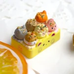 Handcrafted resin Takoyaki artisan keycap, showcasing vibrant miniature Japanese street food details and unique artistry from an captivating angle.