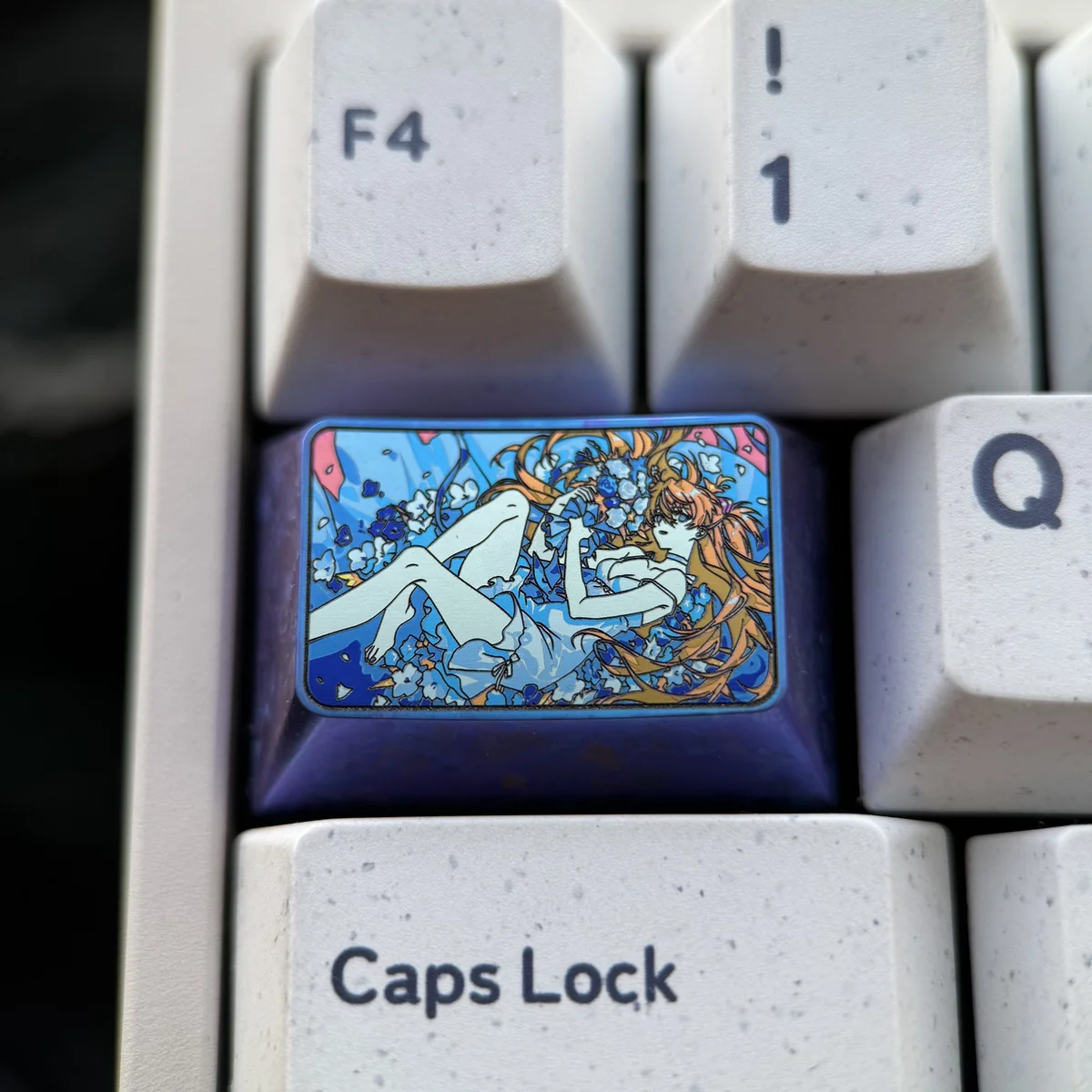Premium Titanium Asuka Keycap, Evangelion 1.5U Tab. Unique angle highlights vibrant anime, reflective titanium, striking colors.