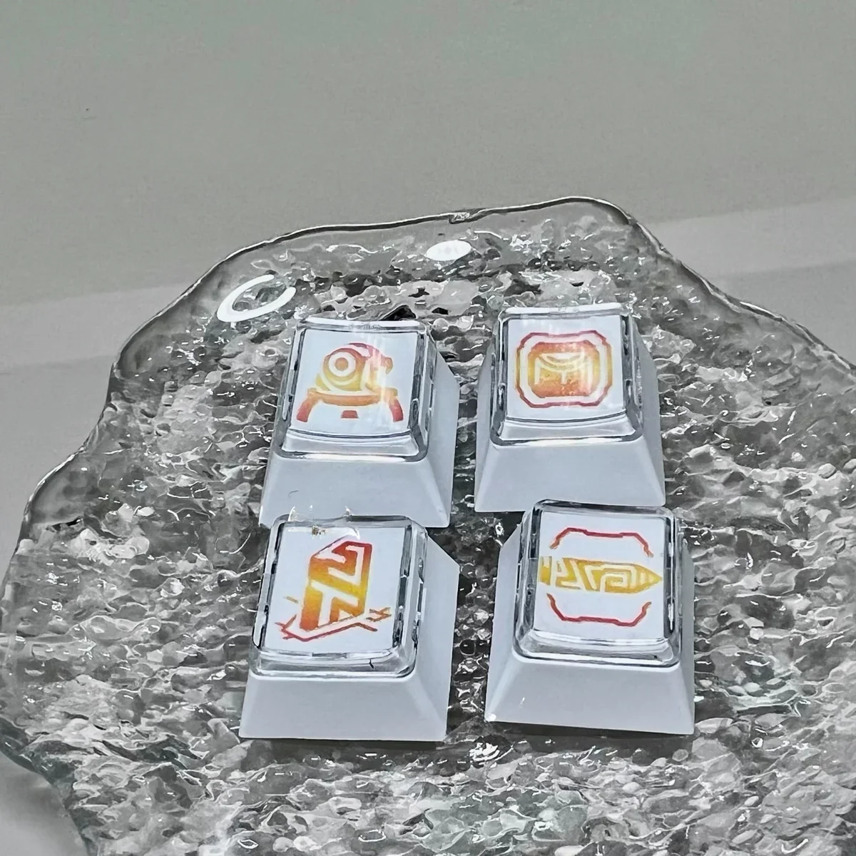 Close-up of the Valorant Chamber Ability Keycaps, showcasing sleek, transparent, and white designs. Premium keycaps capturing Chamber's tactical design.