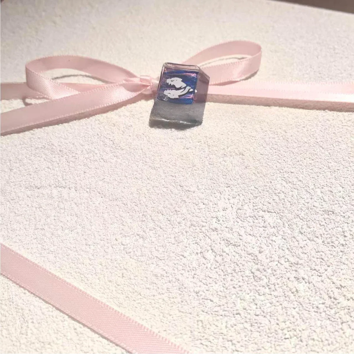 Close-up of a handcrafted Valorant Fade Prowler keycap, showcasing its dark, spectral design from a unique angle, highlighting intricate artisan details.