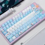 Premium Valorant Jett PBT keycaps set displayed from multiple angles, showcasing the dynamic blue/white design and bright side-illuminated legends.