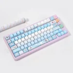 Multiple angles of premium Valorant Jett PBT keycaps set featuring dynamic blue/white backlighting and sleek side-illuminated legends.